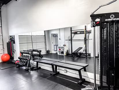Hustle Gym interior with weight training equipment.